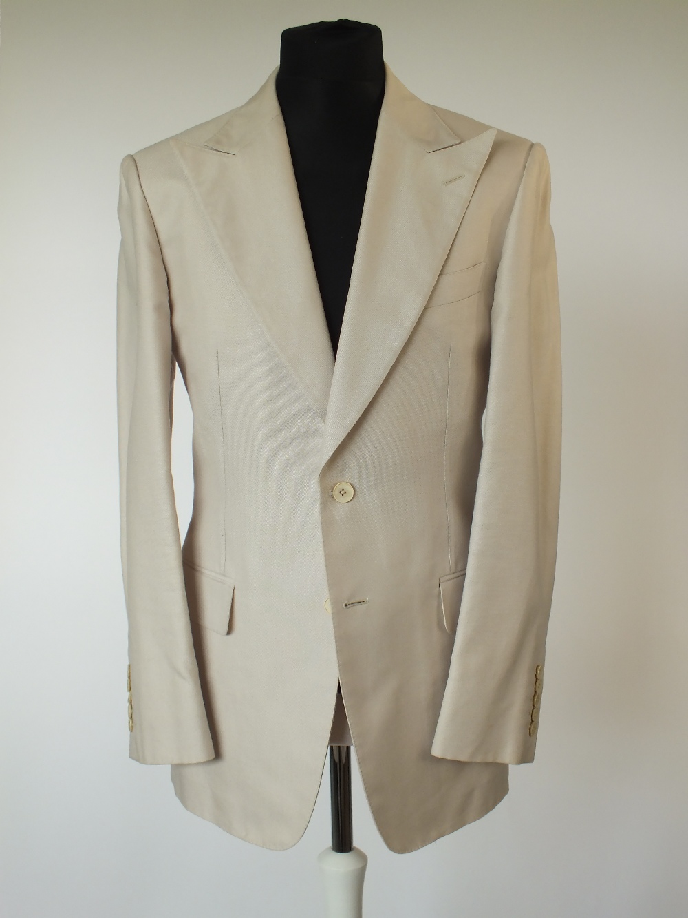 A Gucci suit, stone, double vent, Italian size 50R, 100% cotton, flat front , button fly, signs of