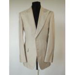 A Gucci suit, stone, double vent, Italian size 50R, 100% cotton, flat front , button fly, signs of