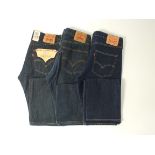 Three pairs of Levi 501, dark blue, one with tags, 34/34