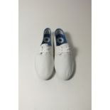 A pair of Lacoste plimsolls, white canvas,UK 9