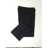 A pair of Gucci trousers, black, flat front, Italian size 50R, 100% wool