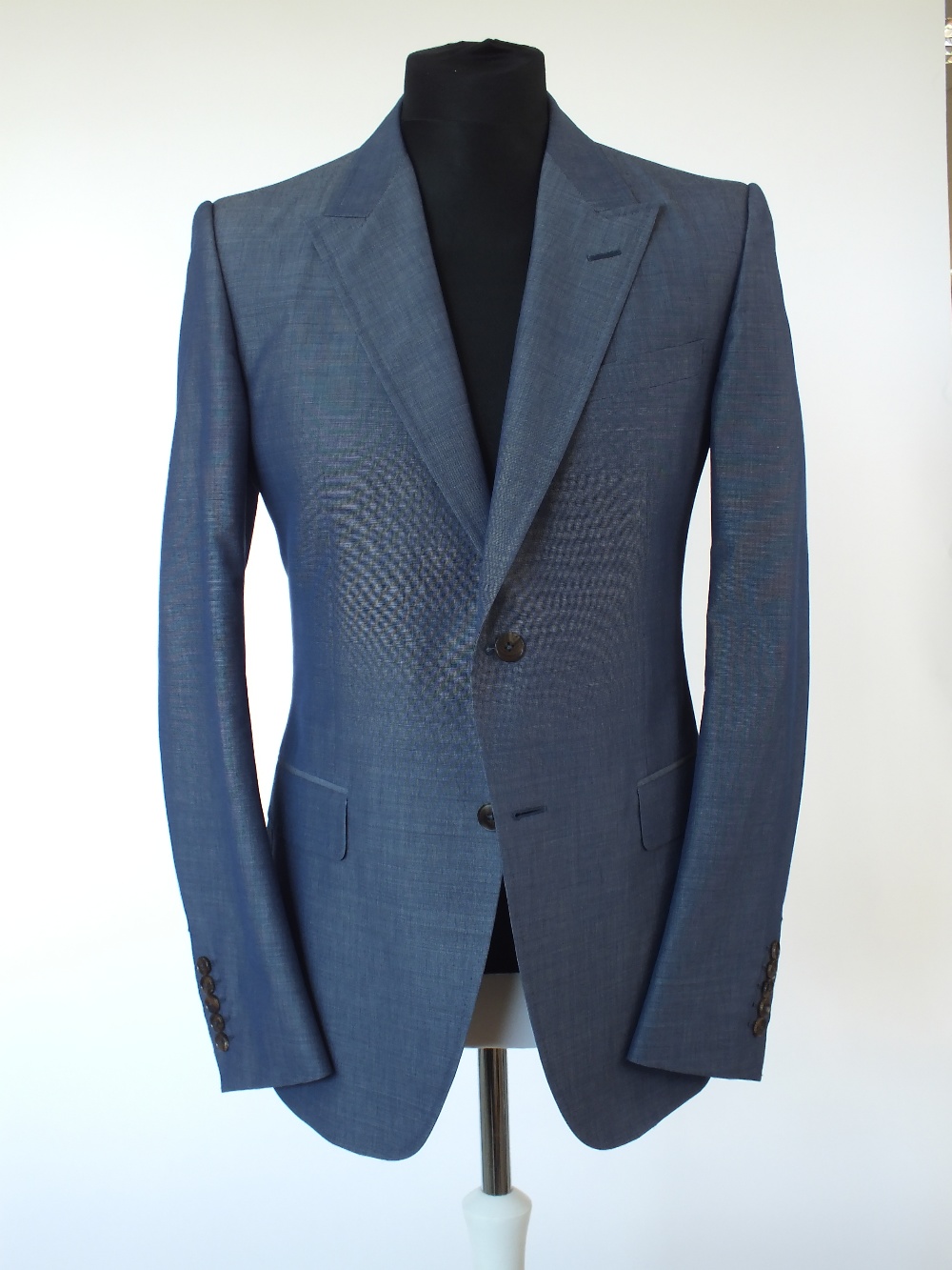 A Gucci suit, blue, brown buttons, single vent, Italian size 52R, 65% cotton, 35% mohair, Gucci