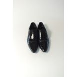 A pair of Gucci evening shoes, black patent, side lace detail, Gucci detail to heel, UK 42E, signs