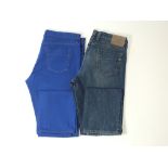 Two pairs of Gucci jeans, one bright blue, one normal denim, Italian size 52