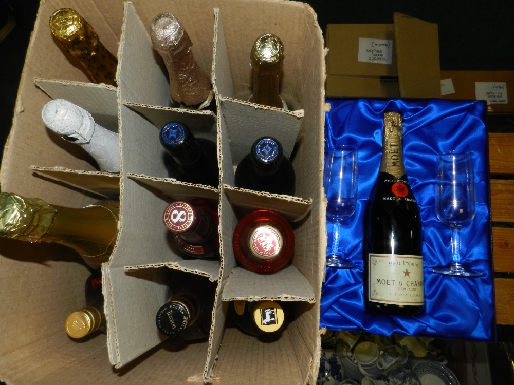 A cased Moet et Chandant Brut Imperial Champagne with two champagne flutes together with other
