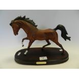 A Beswick horse 'Spirit of Flight' on fixed wood base.