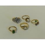 A 9ct yellow gold green stone set dress ring together with a 9ct gold dress ring and three further