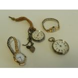 A silver open faced fob watch together with a further open faced fob watch,