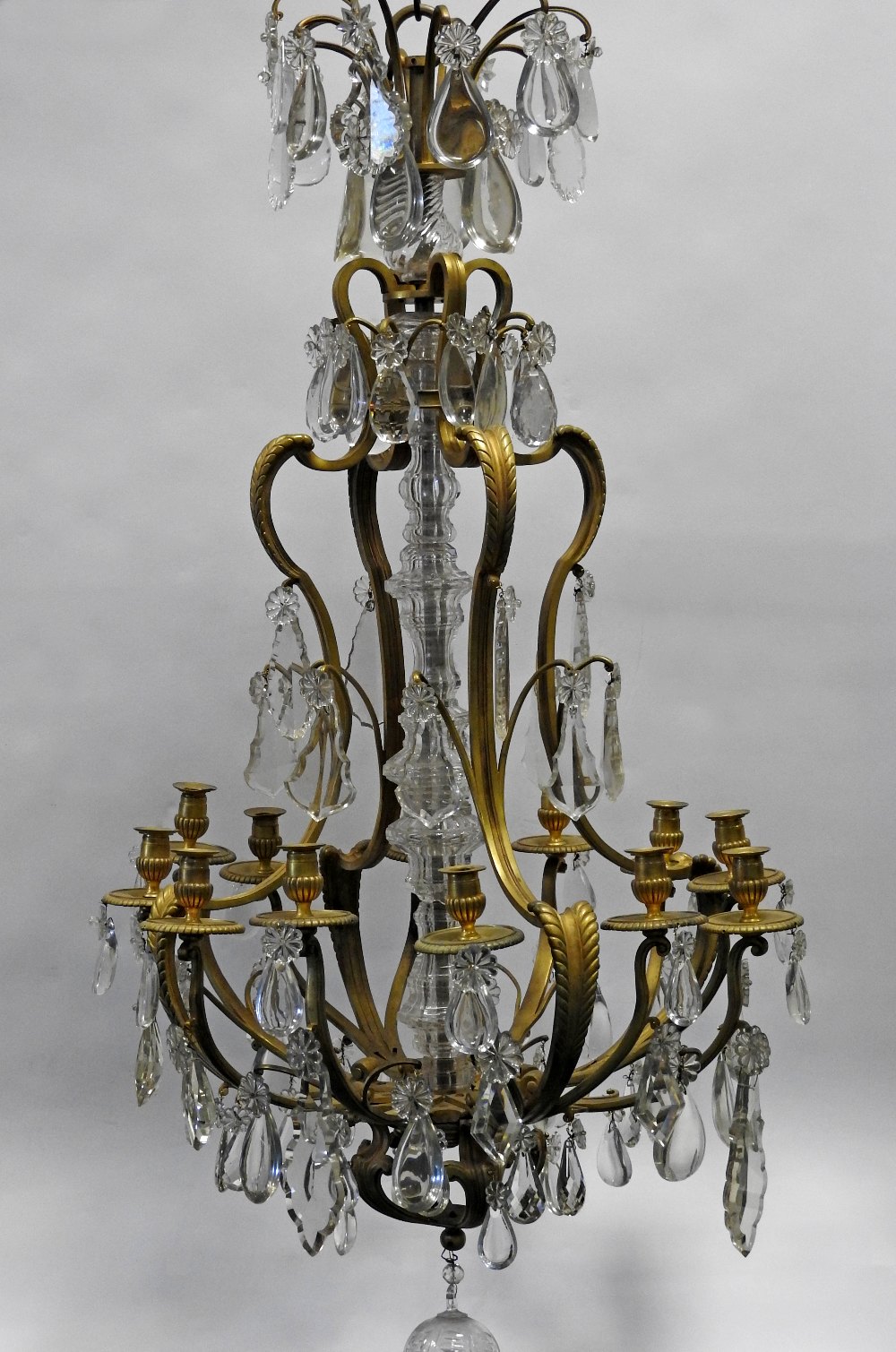 A 19th century French Ormolu and cut glass Louis XVI style twelve branch chandelier hung