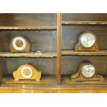 Four various early 20th century wood cased mantel clocks