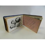 A mid 20th Century autograph book containing various celebrity signatures including: Spike Milligan;