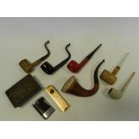 A collection of pipes, a Benlow motorist pipe lighter,