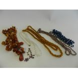 A collection of various glass and bead necklaces