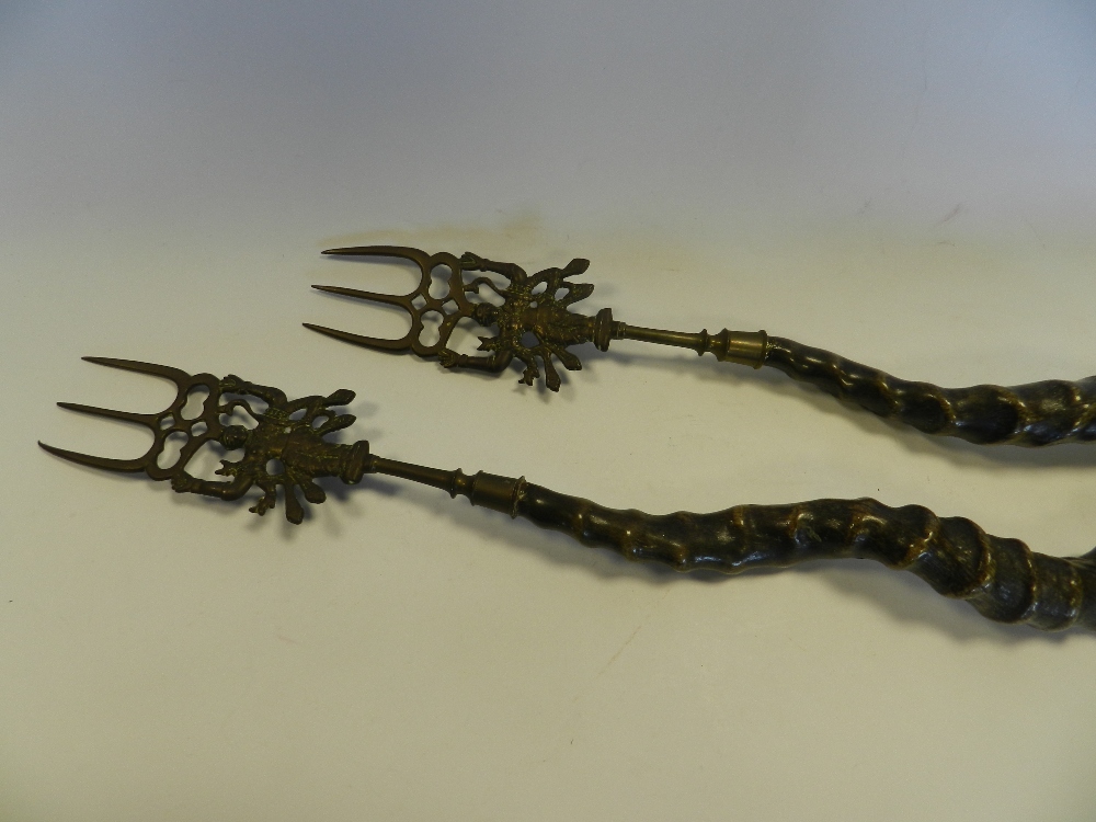 A pair of blackbuck horn toasting forks the horns mounted with South East Asian or Indian metal