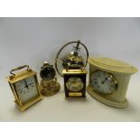 A quantity of mid to late 20th century mantel clocks and carriage style clocks together with an oak