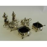 A collection of silver cruets to include: two salts,
