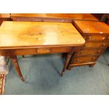 A George IV mahogany fold over tea table on ring turned tapering legs along with a reproduction