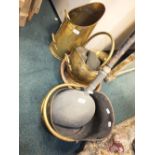 Two brass coal scuttles with swing handles, a brass coal scuttle with fixed handle,