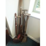 A quantity of vintage wood handled garden tools together with a copper warming pan,