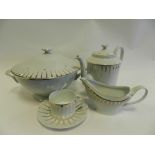 A Limoges coffee and dinner service including tureen, gravy boat stand, dishes, bowls, coffee cups,