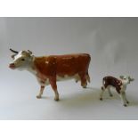 A Beswick Hereford cow and calf (a.