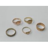 Two 9ct gold signet rings together with a 9ct gold band and two further yellow metal rings