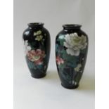 A pair of Japanese cloisonne high shouldered vases decorated with flowers in polychrome