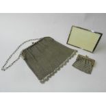 A silver mounted photograph frame together with two metal chain purses