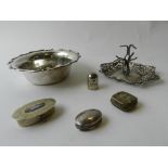 A silver ring tree together with a silver dish and a white metal thimble and three boxes