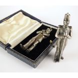 Two cast silver models of a soldiers, TAR, London 1979, one presented within original fitted box,