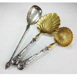 A continental Art Nouveau silver and gilt strawberry spoon and sugar sifter spoon,