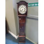An early 20th century oak cased 'grandmother' longcase clock with weight driven movement