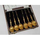A set of six silver gilt coffee spoons in the style of anointing spoons