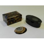 An oval tortoiseshell snuff box with hinged cover together with a miniature tortoiseshell box and