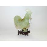 A Chinese green hardstone figure of a cockerel,