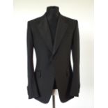 A Gucci dinner suit, black, lower lapel with satin detailing, double vent, Italian size 52R,