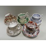 A collection of early to mid 19th century English porcelain tea trios together with later