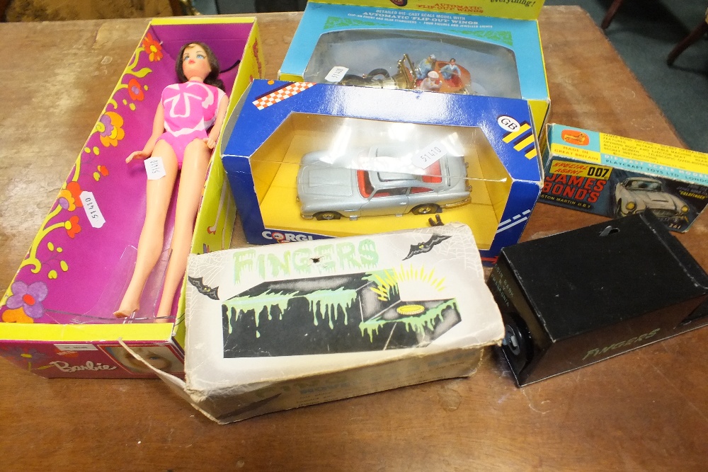 A box containing a Corgi James Bond Aston Martin, a boxed Corgi Chitty Chitty Bang Bang,