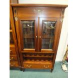 An Empire style mahogany glazed double door side cabinet with wine rack and drawer below, 82cm wide,