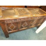 A 17th century joined oak chest with four panel top,