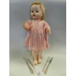 A canteen of electroplated cutlery together with a mid 20th century doll.