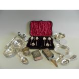 A cased set of silver teaspoons (lacking sugar tongs) together with a silver sugar bowl with cusped