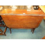 An Edwardian mahogany drop-leaf Sutherland table