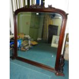 A Victorian style overmantel mirror with mahogany foliate frame and bevelled plate, 147cm wide,