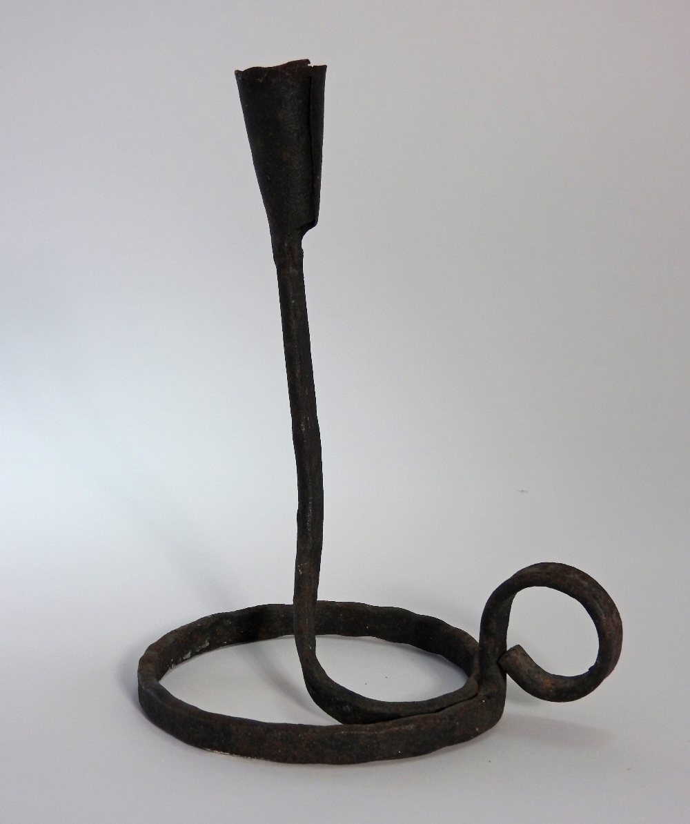 A 19th century wrought iron socket stick of chamber form with spiral base and loop handle, - Bild 2 aus 2