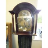 A reproduction three train grandmother clock in mahogany finished case with glazed door,