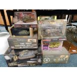 A group of seven boxed die cast military vehicles by various manufacturers including Corgi,