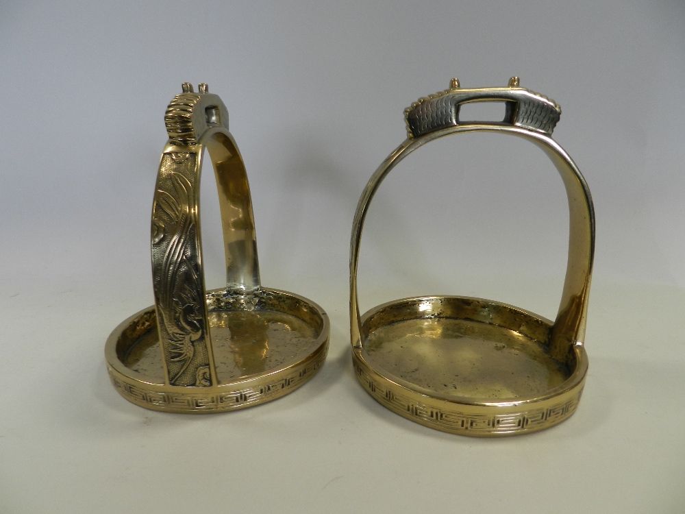 A Sino Tibetan brass stirrup cast with Phoenix birds and fret designs