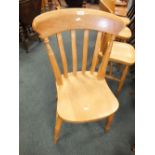 A set of four beech lath back kitchen chairs