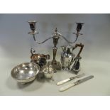 A quantity of electroplated wares to include a pair of two branch candelabra,